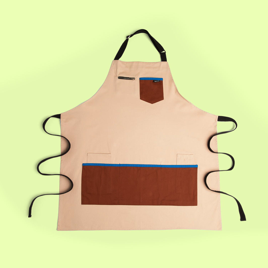 Quell art apron in cream and chocolate with front pockets